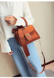 Bow shoulder cross body bag